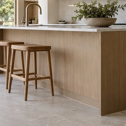Representative kitchen island with timber cabinetry, stone surfaces and casual seating