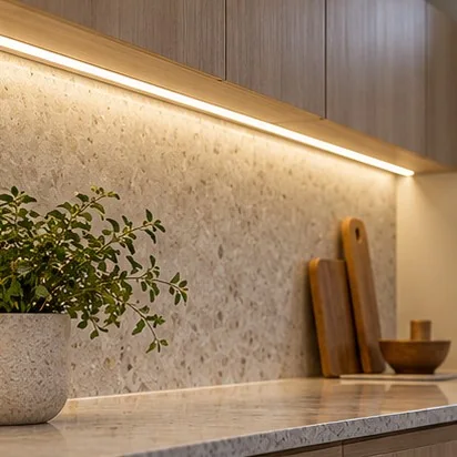 Representative warm LED strip lighting beneath kitchen overhead cabinetry